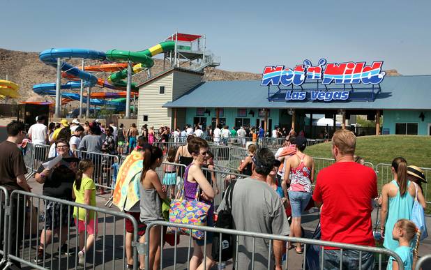 People wait in line for the doors to open during the first day of general admission at Wet'n'Wild Las Vegas on Monday, June 3, 2013.