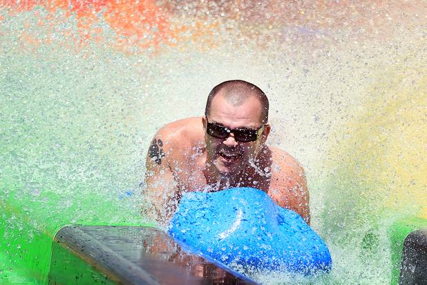 Chris Nagy of Las Vegas rides the Desert Racers water slide during the first day of general admission at Wet'n'Wild Las Vegas on Monday, June 3, 2013.