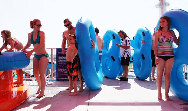 Guests line up to ride the water slides during the first day of general admission at Wet'n'Wild Las Vegas on Monday, June 3, 2013.