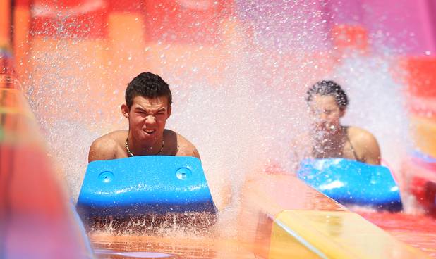 Kyle Christiensen, 17, of Las Vegas rides the Desert Racer  water slide during the first day of general admission at Wet'n'Wild Las Vegas on Monday, June 3, 2013.