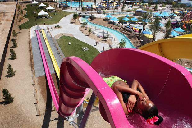 Ashley White of Las Vegas rides the Canyon Cliffs water slide during the first day of general admission at Wet'n'Wild Las Vegas on Monday, June 3, 2013.