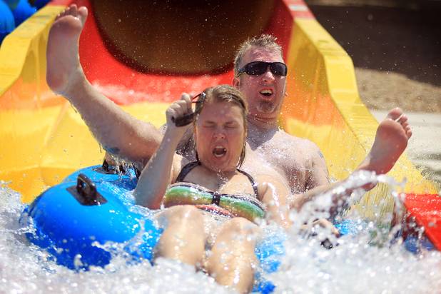 Rich Cumming and his fiance Jennifer (who did not want her last name used), both of Las Vegas, ride the Constrictor water slide during the first day of general admission at Wet'n'Wild Las Vegas on Monday, June 3, 2013.