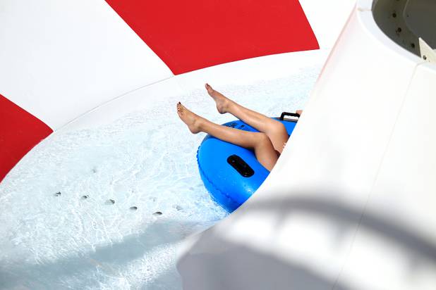 A guest rides the Royal Flush Extreme during the first day of general admission at Wet'n'Wild Las Vegas on Monday, June 3, 2013.
