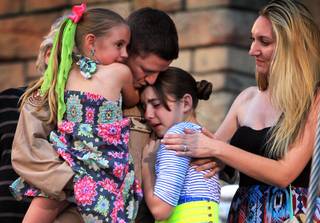 U.S. Air Force Capt. John Costa surprises his daughters by appearing at the end of the 