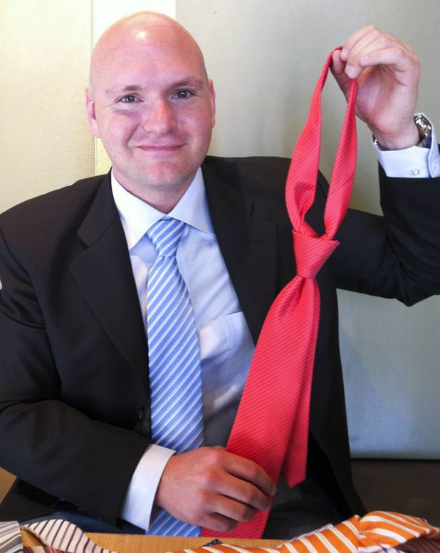 Adam Lucero, creator of the GoTie, poses with one of his ties, June 4, 2013.