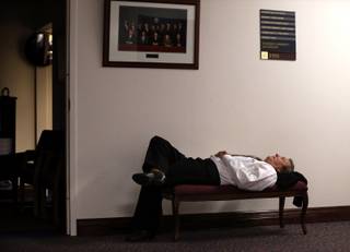 Nevada Assemblyman John Ellison, R-Elko, naps after lawmakers failed to meet their midnight deadline for the end of the 77th Legislative session in Carson City, Nev., Tuesday, June 4, 2013. 