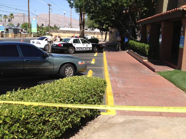 Metro Police investigate an officer-involved shooting Tuesday, June 4, 2013 at the Oasis Ridge Apartments complex, 3040 E. Charleston Blvd.