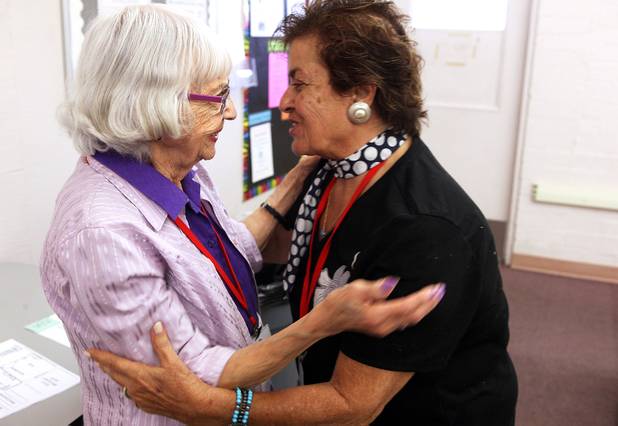Ruth Elliott, 92, left, says goodbye to Suzy Simotta-Zazour, right, a student and snowbird who lives in Montreal in the summer, during a break in the parapsychology course Elliott teaches to seniors at the Osher Lifelong Learning Institute at UNLV Paradise campus in Las Vegas on Wednesday, June 5, 2013.