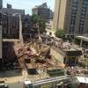 Emergency personnel respond to a building collapse in downtown Philadelphia, where the city fire commissioner says as many as eight to 10 people are believed trapped in the rubble, Wednesday, June 5, 2013.