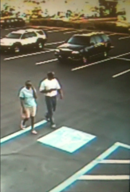 Metro Police released a surveillance video that captured these two people on camera. The man, police believe, robbed a business on the evening of May 15, 2013, and police are trying to identify both hiim and the woman with him.