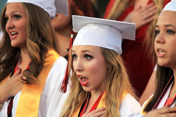 Las Vegas High School valedictorian Natasha Greene sings in the choir during her commencement ceremony on the school's football field in Las Vegas on Friday, June 7, 2013. Greene has had perfect attendance and perfect grades since kindergarten.