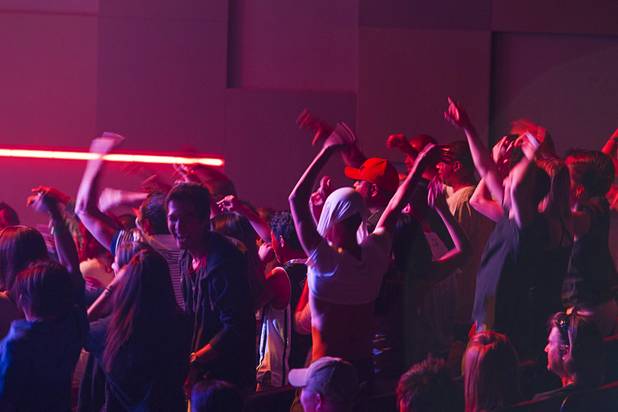 Audience members cheer as Jabbawockeez cast members perform in "Prism," their new show at the Luxor, Sunday, June 9, 2013.