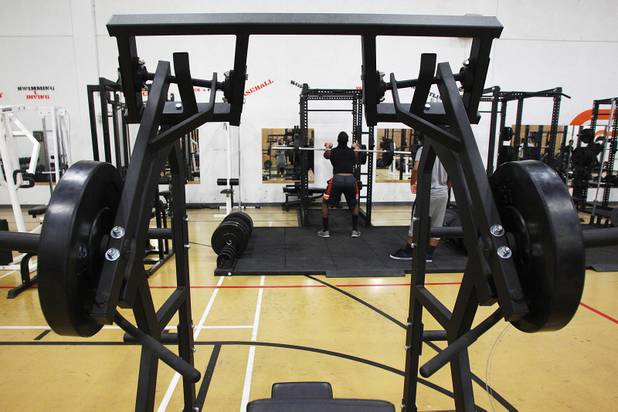 Football players use new equipment in the weight room at Chaparral courtesy of an anonymous donor Tuesday, June 11, 2013.