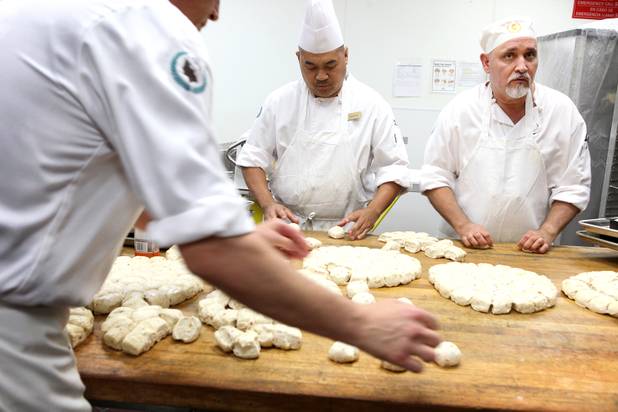 Bakers Johnmar Viray, left, and Gabriel Shavalier work on bread inside the basement bakery at Caesars Palace in Las Vegas on Tuesday, June 11, 2013.