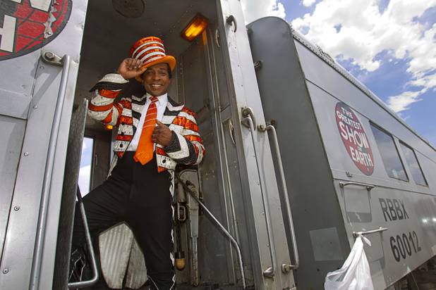 Ringmaster Andre McClain poses on the Ringling Bros. and Barnum & Bailey Circus train Wednesday, June 12, 2013. Circus performers teamed up with the Three Square Food Bank to pack 100 food backpacks for local families. The circus opens Thursday at the Thomas & Mack Center and runs through Sunday.