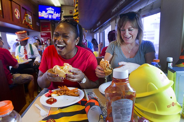 Circus publicist Alicia Jones, left and Laurie King of the Three Square Food Bank eat lunch on the Ringling Bros. and Barnum & Bailey Circus train Wednesday, June 12, 2013. Circus performers and staff teamed up with Three Square to pack 100 food backpacks for local families and hosted Three Square families with lunch on the train. The circus opens Thursday at the Thomas & Mack Center and runs through Sunday.