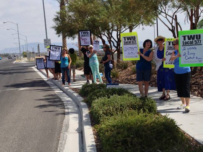 Members of the Transportation Workers Union protest on the second anniversary of the start of negotiations for a contract for Allegiant Air flight attendants in front of the airline's headquarters in Las Vegas.