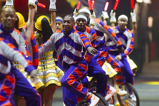 Unicyclists with the King Charles Troupe weave in and out of a row of women dressed as road workers during the opening night of the Ringling Bros. and Barnum & Bailey Circus at the Thomas & Mack Center Thursday, June 13, 2013. The "Built to Amaze!" tour runs through Sunday, June 16.