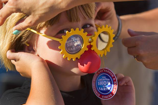 Willow Shank, 6, tries on novelty glasses before the opening night of the Ringling Bros. and Barnum & Bailey Circus at the Thomas & Mack Center Thursday, June 13, 2013. The "Built to Amaze!" tour runs through Sunday, June 16.