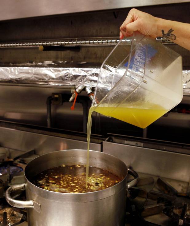 Beverage chef Aaron Bryan adds ingredients to eight spice syrup inside the Mixology Kitchen at the Cosmopolitan in Las Vegas on Thursday, June 13, 2013.