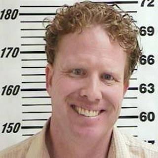 This undated file photo provided by the Davis County Jail, shows Jeremy Johnson, who has pleaded not guilty to a federal mail fraud. Attorneys for Johnson charged with bilking consumers of $350 million are asking a  judge to reconsider his bail.  Johnson was ordered held pending trial, but a judge said he'd consider release if the man could post $1 million bond. The 35-year-old was arrested June 11 at the Phoenix airport carrying a one-way plane ticket to Costa Rica and more than $26,000 in cash. 