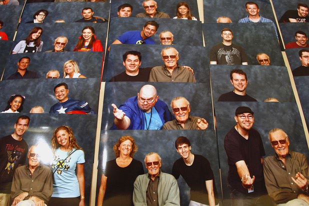 A table covered with photos of Stan Lee and fans wait for pick up at the Amazing Las Vegas Comic Con at the South Point Saturday, June 15, 2013.