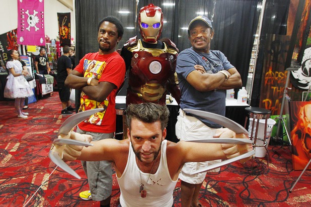 Jamaal Hardy, left, and Gus Hardy pose with characters Ross Johnson, dressed as Wolverine, and Daniel Castro, dressed as Iron Man, at the Amazing Las Vegas Comic Con at the South Point Saturday, June 15, 2013.