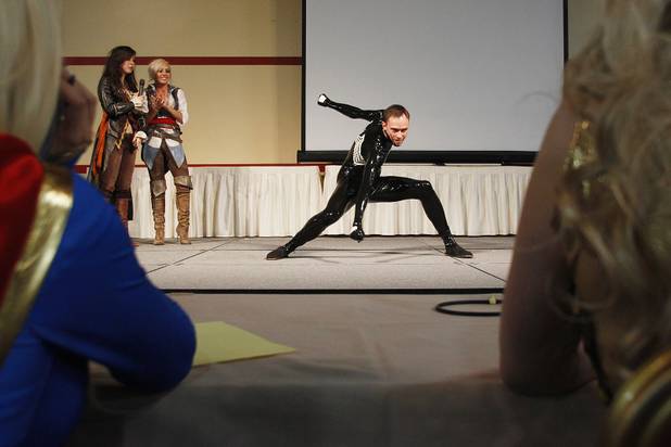 Chris Thompson shows off as Spiderman during a costume contest at the Amazing Las Vegas Comic Con at the South Point Saturday, June 15, 2013.