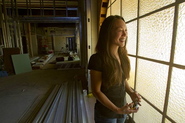 Connie Yeh, head of the Downtown Project Education initiative, stands by a window in what will be a classroom during a tour of the 9th Bridge School at 9th Street and Bridger Avenue in downtown Las Vegas Monday, June 17, 2013. The yellow glass will be replaced with clear glass for natural lighting, she said. The private school/early childhood learning center, part of the DowntownProject, is scheduled to open August 26 with infants through kindergarten students and gradually add grades.