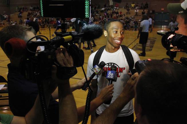 UNLV transfer Kevin Olekaibe talks to the media before his  game on the first night of the Desert Reign tournament Tuesday, June 18, 2013.
