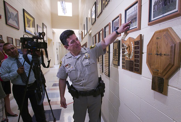Metro Police Deputy Chief Gary Schofield points to himself in a 1985 police academy graduating class photo during a tour of the Metro Police training facility Wednesday, June 19, 2013. With the recent passage of the "More Cops" bill, Metro Police announced they will soon hold the first police academy since January 2012.