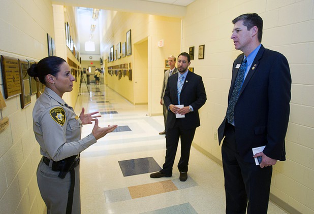 Metro Police Officer Melodie DePierro gives a tour of the Metro Police training facility to Michael Naft, center, district director for Congresswoman Dina Titus, and James Healey, state assemblyman for district 35, Wednesday, June 19, 2013. With the recent passage of the "More Cops" bill, Metro Police announced they will soon hold the first police academy since January 2012.