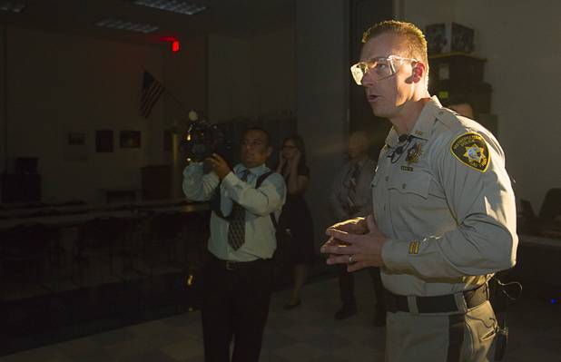 Metro Police Officer Fred Oliveri talks down a subject in a MILO training video during a demonstration of the system at the Metro Police training facility Wednesday, June 19, 2013. MILO (Multiple Interactive Learning Objectives) is a interactive training system for cadets and officers. With the recent passage of the "More Cops" bill, Metro Police announced they will soon hold the first police academy since January 2012.