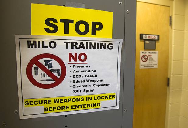 Signs are posted at the entrance to the MILO training room at the Metro Police training facility Wednesday, June 19, 2013. MILO (Multiple Interactive Learning Objectives) is a interactive training system for cadets and officers. With the recent passage of the "More Cops" bill, Metro Police announced they will soon hold the first police academy since January 2012.
