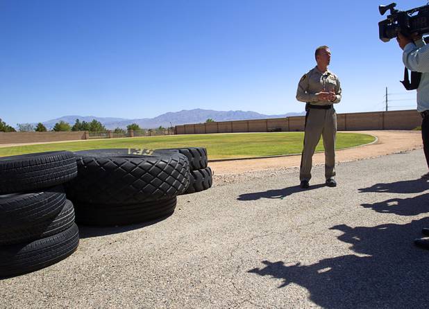 Metro Police Officer Fred Oliveri shows of the physical training field during a tour of the Metro Police training facility Wednesday, June 19, 2013. Oliveri is a Training Advising and Counseling (T.A.C.) officer. With the recent passage of the "More Cops" bill, Metro Police announced they will soon hold the first police academy since January 2012.