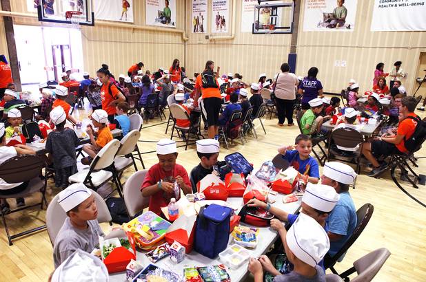 during Summer Food Service Program lunch at the Heinrich YMCA in Las Vegas on Wednesday, June 19, 2013. The Summer Food Service Program is a federal nutrition program designed to feed children free, nutritious meals and snacks during the months of June, July, and August when school is out.