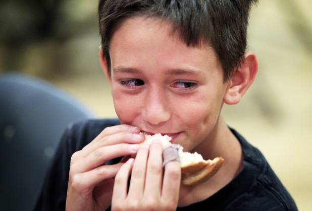 Jack Soberinsky, 9, eats lunch during the Summer Food Service Program at the Heinrich YMCA in Las Vegas on Wednesday, June 19, 2013. The Summer Food Service Program is a federal nutrition program designed to feed children free, nutritious meals and snacks during the months of June, July, and August when school is out.