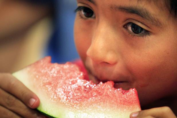 Johnny Cabonce, 8, eats during Summer Food Service Program lunch at the Heinrich YMCA in Las Vegas on Wednesday, June 19, 2013. The Summer Food Service Program is a federal nutrition program designed to feed children free, nutritious meals and snacks during the months of June, July, and August when school is out.
