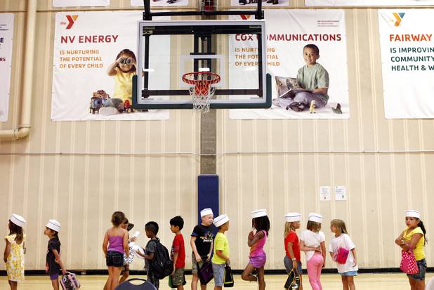 Children line up after Summer Food Service Program lunch at the Heinrich YMCA in Las Vegas on Wednesday, June 19, 2013. The Summer Food Service Program is a federal nutrition program designed to feed children free, nutritious meals and snacks during the months of June, July, and August when school is out.