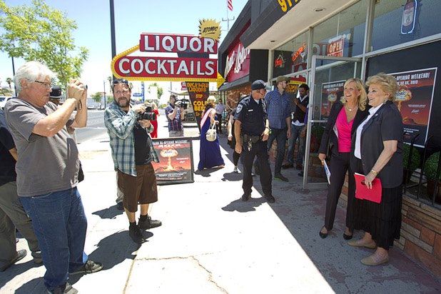 Mayor Carolyn Goodman poses for a photo with Kathleen Frantz, development director for the National Atomic Testing Museum, during the grand reopening of The Atomic on East Fremont Street Wednesday, June 20, 2013. The bar was originally built in 1945 as Virginia's Cafe but was renamed Atomic Liquors in 1952 when patrons used to go to the roof to watch the nuclear blasts from the Atomic Test Site.