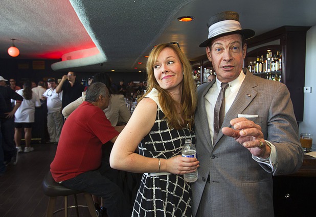 Dorian Stonebarger, left, poses with entertainer CJ "The Voice" Sinestro during the grand re-opening of The Atomic on East Fremont Street Wednesday, June 20, 2013. The bar was originally built in 1945 as Virginia's Cafe but was renamed Atomic Liquors in 1952 when patrons used to go to the roof to watch the nuclear blasts from the Atomic Test Site.