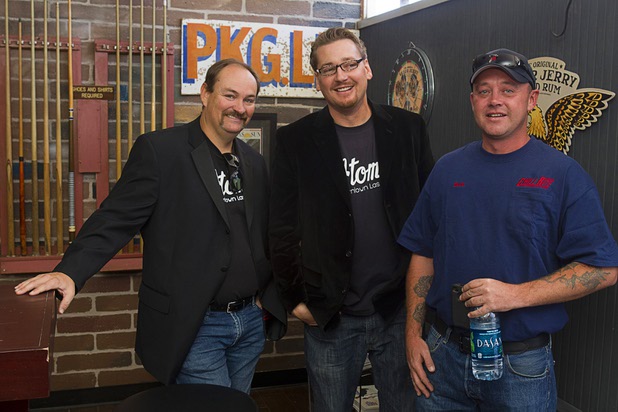 Lance Johns,left, and Co-owners Derek Stonebarger, center, pose with Bob Crone, lead technician for Chill Rite, before the grand re-opening of The Atomic on East Fremont Street Wednesday, June 20, 2013. Chill Rite installed the air conditioning for the remodel. 