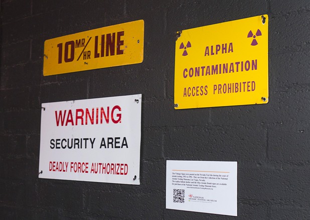 Signs from the Nevada Test Site, on loan from National Atomic Testing Museum, are displayed at The Atomic on East Fremont Street Wednesday, June 20, 2013.