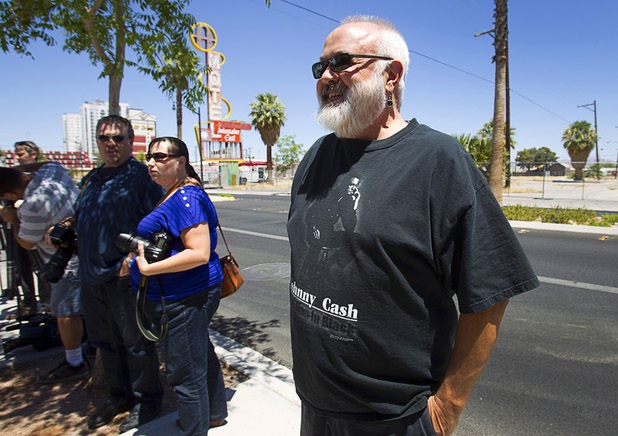 Lane B. (no last name given) waits for the grand re-opening of The Atomic on East Fremont Street Wednesday, June 20, 2013.