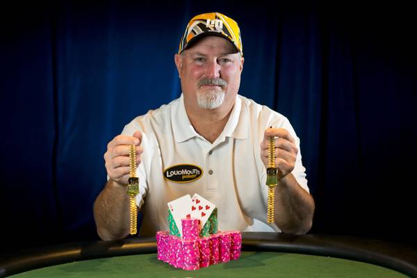 Tom "The Donkey Bomber" Schneider poses with the two HORSE bracelets he's won at the 2013 World Series of Poker on June 16 2013. 