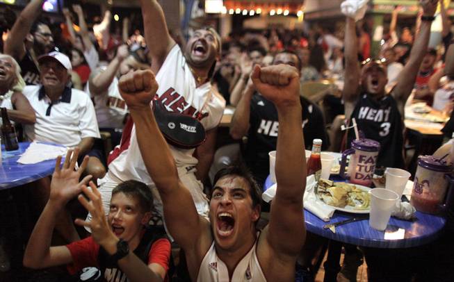 Miami Heat fans react while watching Game 7 of the NBA Finals between the Heat and the San Antonio Spurs in Miami, on Thursday, June 20, 2013.