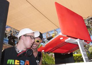 Colorado teen Tanner Seebaum, left, is given props by DJ Landon Dykesterhouse as he plays music for the weekend revelers at Rehab. Seebaum was diagnosed with an inoperable brain tumor and has battled cancer most of his life, and was granted a special wish to be a DJ by the Hard Rock Hotel on Saturday afternoon.