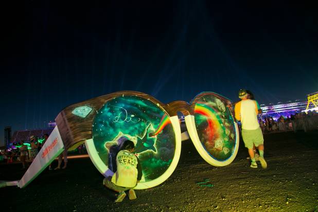 A giant psychedelic pair of Chilli Beans sunglasses are on display at the Electric Daisy Carnival, Saturday June 22, 2013.