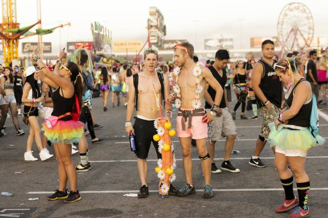 Fans look around and take pictures at the end of day two of the Electric Daisy Carnival Festival, EDC, at the Las Vegas Motor Speedway, Sunday morning, June 23, 2013.
