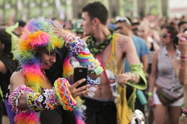 A fan takes a picture of herself at the Electric Daisy Carnival Festival, EDC, at the Las Vegas Motor Speedway, Sunday morning, June 23, 2013.